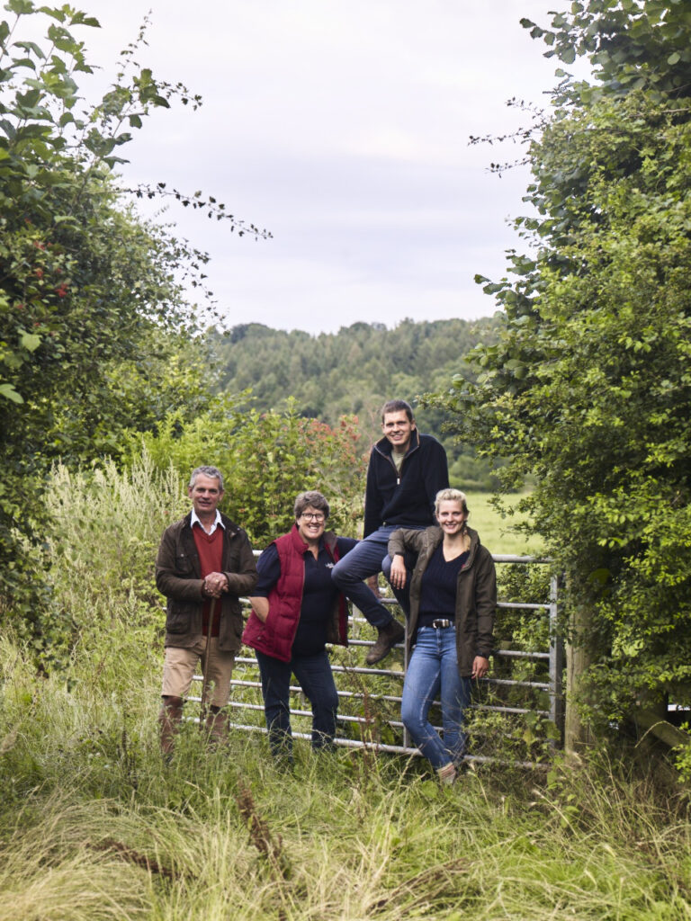Ballingham Court farm landscape with cattle, orchards, and Wye Valley countryside in view."